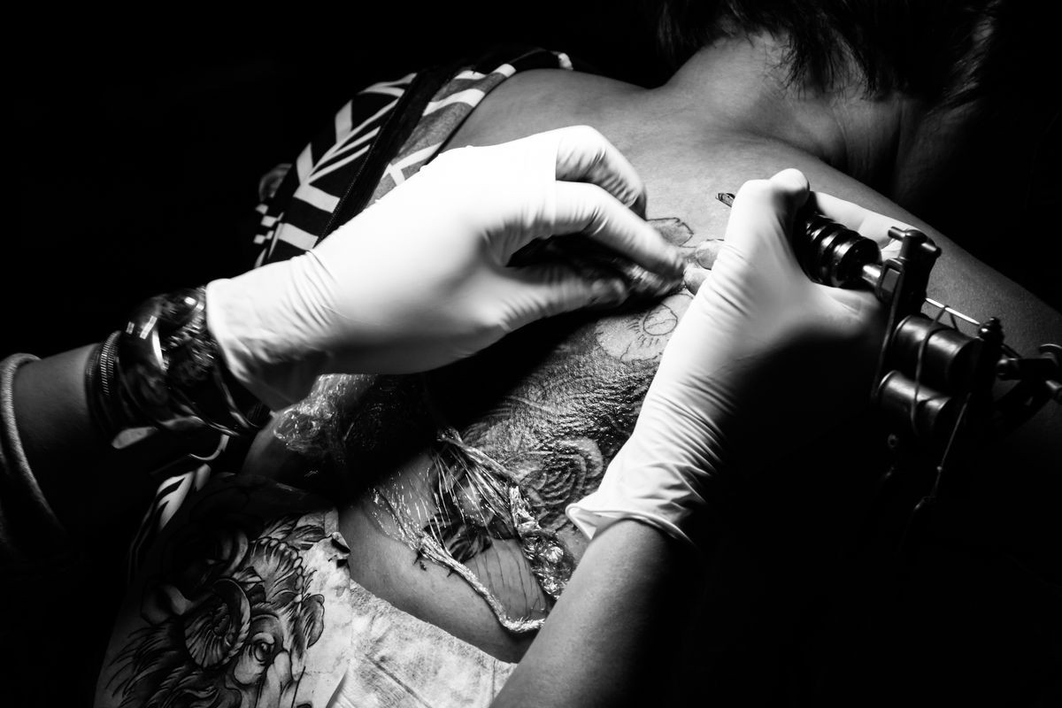 Showing process of making a tattoo black and white tone. Tattoo design in pattern : Tattoos art on human skin